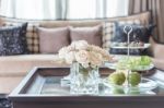 Glass Vase Of Flower On Wooden Table In Living Room Stock Photo