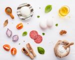 The Ingredients For Homemade Pizza On White Wooden Background Stock Photo