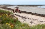 Boulmer, Nortumberland/uk - August 16 : Tractor On A Sandy Beach Stock Photo