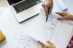 Architects Engineer Discussing At The Table With Blueprint - Clo Stock Photo