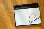 Sexy Girl Red Lips Kiss And "love You" Word Write On White Note Paper On Bed Stand Table In The Morning Light. Romantic Message From Couple Stock Photo