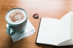 Coffee Cup And Notebook On Wooden Table With Copy Space Stock Photo