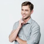 Confident Young Casual Man Thinking Stock Photo