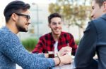 Outdoor Portrait Of Young Entrepreneurs Working At Coffee Bar Stock Photo