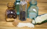 Sesami Seed And Rice In Bottles Stock Photo