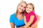 Adorable Mom And Daughter Posing Together Stock Photo