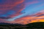 Sun Setting Beyond Palau In Sardinia Stock Photo