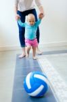 Baby Girl Learning To Walk At Home Stock Photo