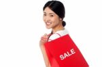 Cheerful Young Shopaholic Girl Stock Photo