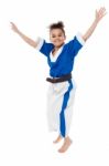 Enthusiastic Young Girl Kid In Karate Uniform Stock Photo