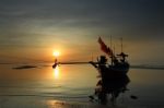 Longtail Boat In The Sunrise Over Sea And Blue Sky Stock Photo