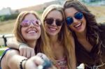 Beautiful Young Women Using Mobile Phone In The Street Stock Photo