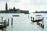 Gondolier Ferrying People In Venice Stock Photo