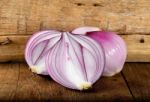 Red Onion On The Wooden Background Stock Photo