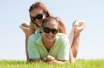 Couple Enjoying In Park Stock Photo