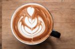 Top View Of Hot Coffee On Wooden Table Stock Photo