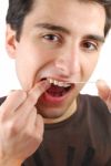 Man Flossing His Teeth Stock Photo