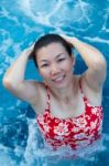 Asian Woman Enjoy And Relaxing In Spa Pool On Vacation Stock Photo