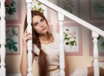 Girl Sits On The Stairs Stock Photo