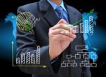 Businessman Hand Drawing Graph Stock Photo