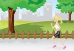 A Girl Is Jogging In A Park Stock Photo