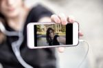 Young  Woman Taking A Photo With Her Phone Stock Photo