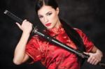 Woman Holding Katana Weapon Stock Photo