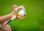 Child Hand Painting Easter Egg With Paintbrush Stock Photo