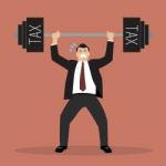 Businessman Lifting A Heavy Weight Tax Stock Photo