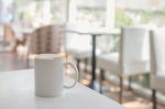 White Coffee Cup In Coffee Shop Stock Photo