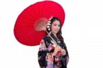 Beautiful Young Asian Woman Wearing Traditional Japanese Kimono With Red Umbrella Isolated On White Background Stock Photo