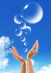 Hand Hold Bubbles In The Sky Stock Photo