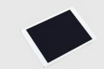 Tablet Computer On Grey Background Stock Photo