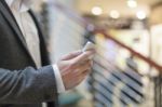 Man With Smartphone In Business Building Stock Photo