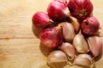 Garlic On Chopping Block Stock Photo