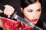 Woman Holding Katana Weapon Stock Photo