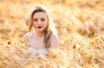 Portrait Of Beautiful Girl In Field Stock Photo