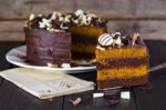 Slice Of Chocolate And Toffee Layer Cake Stock Photo