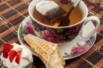 Cup Of Tea With Pastry After Dinner Stock Photo