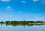 Summer Forest River With Reflection Of The Sky Stock Photo