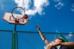 Young Man Playing Basketball Stock Photo