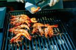 Grilled King Size Prawns On Fire Stock Photo