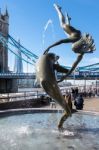 David Wayne Sculpture "girl With The Dolphin" Next To Tower Brid Stock Photo