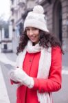 Beautiful Woman In Red Coat And Wool Cap And Gloves With Smartph Stock Photo