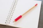 Blank Notebook With Pencil On Grey Background Stock Photo