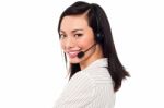 Smiling Attractive Call Center Executive Stock Photo