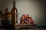 Empty Glass And Grapes On Tray Stock Photo