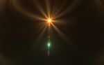 Abstract Sun Burst With Digital Lens Flare Background Stock Photo