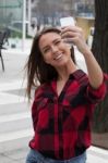 Young Brunette With A Smart Phone Stock Photo