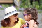 Portrait Of Mother And Daughter Outdoors Looking Each Other In S Stock Photo